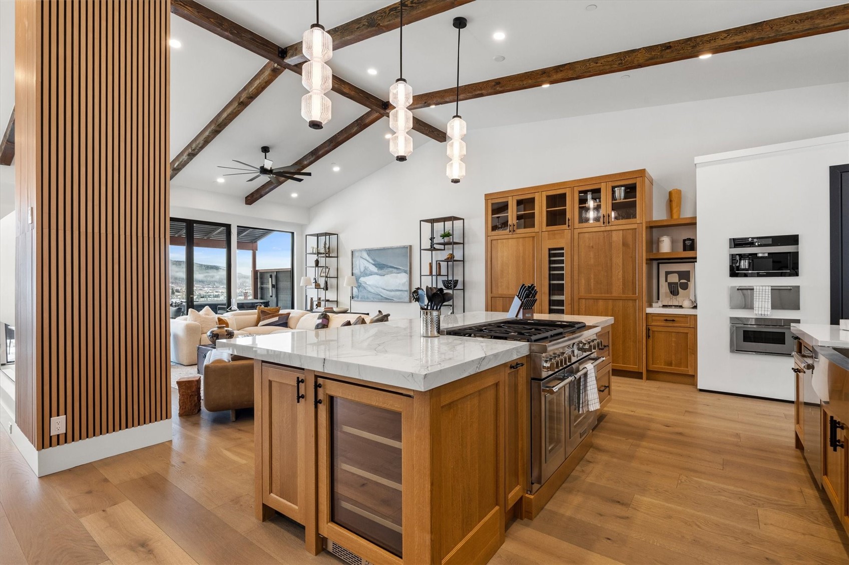 1855 Burgess Creek Road, Unit 4 Steamboat Springs, CO 80487 - Photo 5 of 42 a large kitchen with stainless steel appliances granite countertop a stove and cabinets