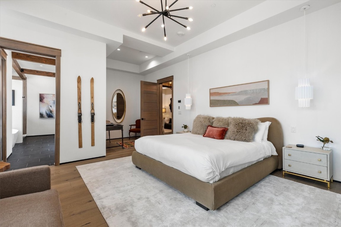 1855 Burgess Creek Road, Unit 4 Steamboat Springs, CO 80487 - Photo 7 of 45 a spacious bedroom with a bed and ceiling fan