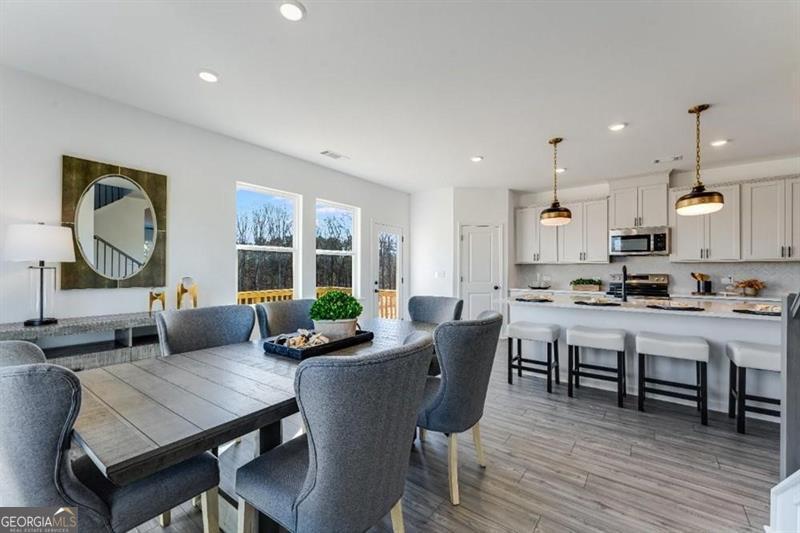 3276 Durston Dacula, GA 30019 - Photo 1 of 7 a view of a dining room with furniture window and wooden floor