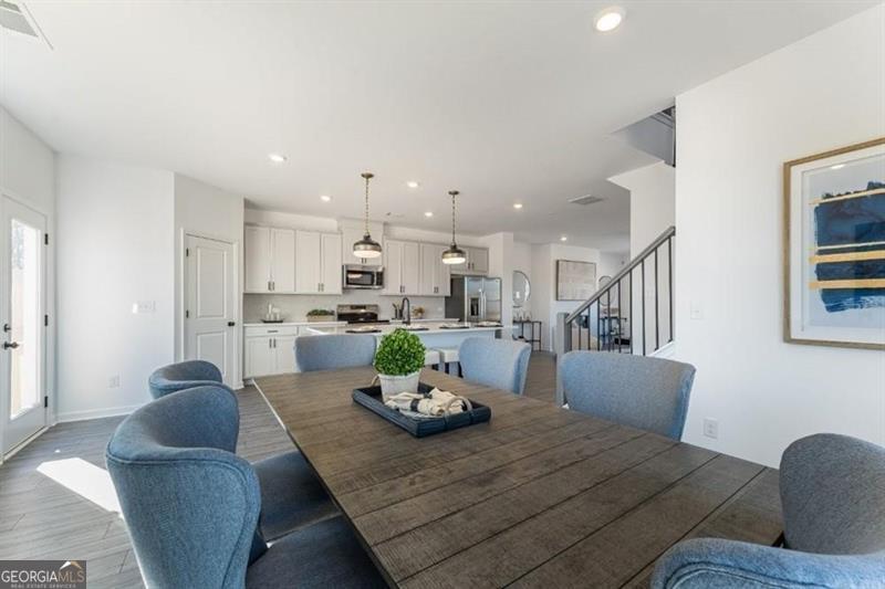 3276 Durston Dacula, GA 30019 - Photo 3 of 7 a living room with furniture kitchen and a table