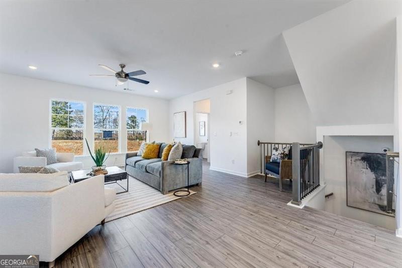 3276 Durston Dacula, GA 30019 - Photo 4 of 7 a living room with furniture and a large window