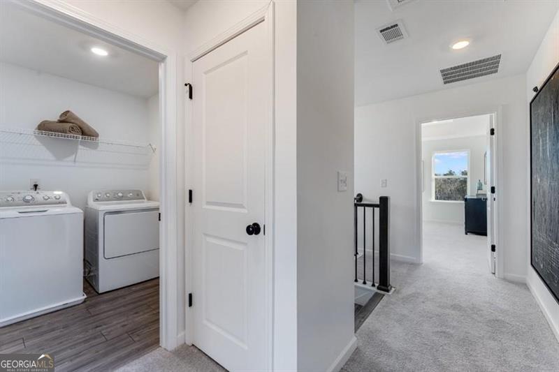 3276 Durston Dacula, GA 30019 - Photo 5 of 7 a view of a hallway with closet and wooden floor
