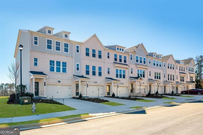 3276 Durston Dacula, GA 30019 - Photo 7 of 7 a city view with tall buildings and a yard