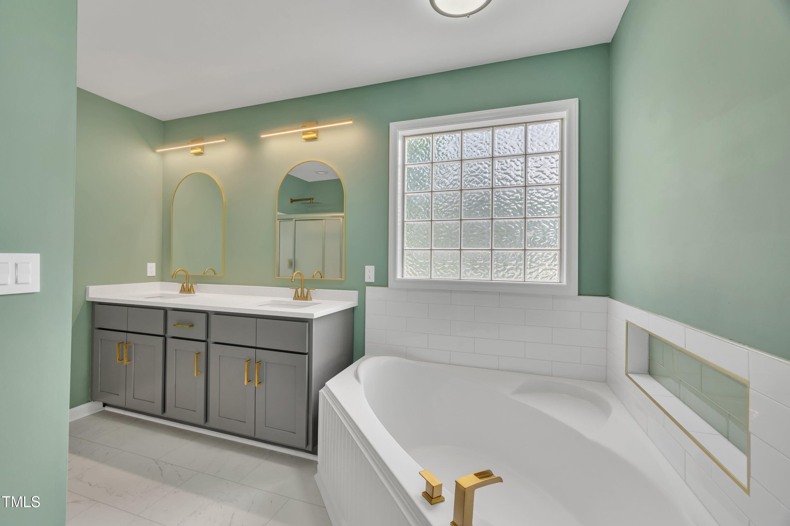 112 Edmondson Drive Willow Spring, NC 27592 - Photo 9 of 32 a bathroom with a tub sink and mirror