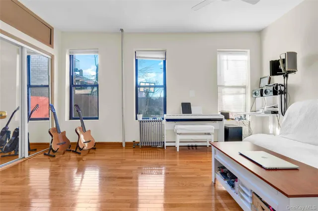 a room with lots of table and windows