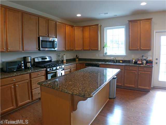 3104 Cranberry Ridge Drive High Point, NC 27265 - Photo 7 of 16 Kitchen. Beautiful granite countertops & large work island!