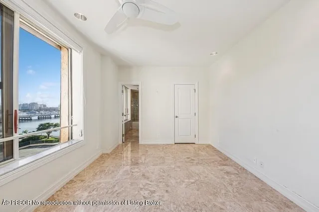a bathroom with a bathtub shower sink mirror and toilet