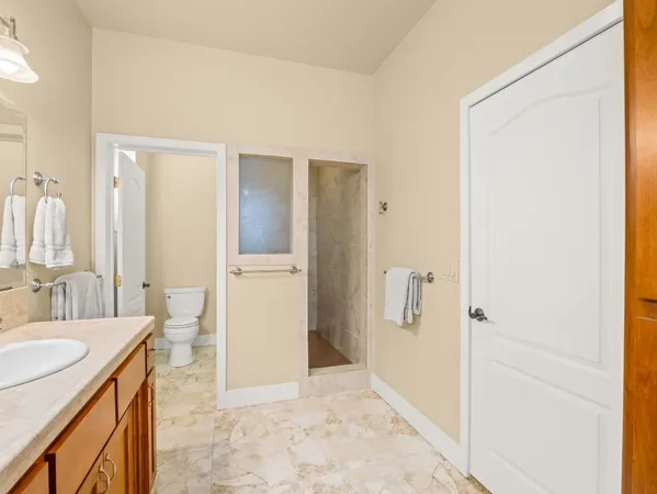 a bathroom with a tub sink and mirror