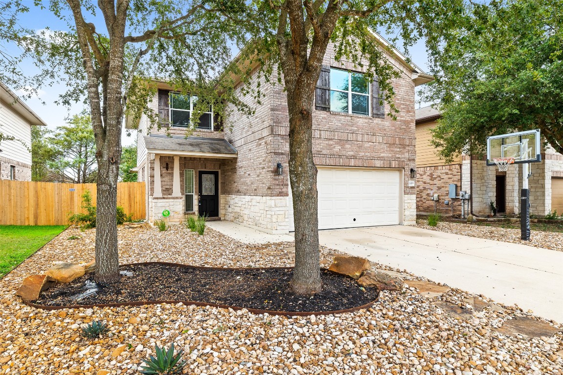 1809 Bill Baker Drive Austin, TX 78748 - Photo 1 of 1 a front view of a house with a yard