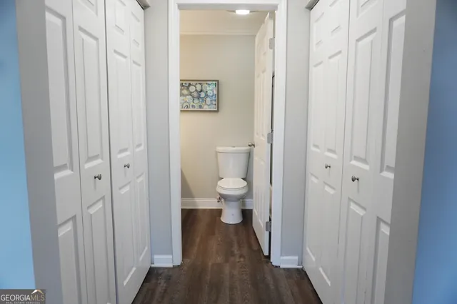 a view of a bathroom from a hallway