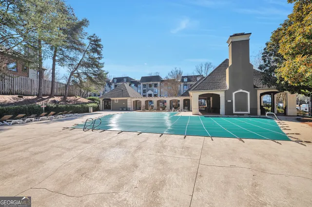 a view of house with a garden and pathway