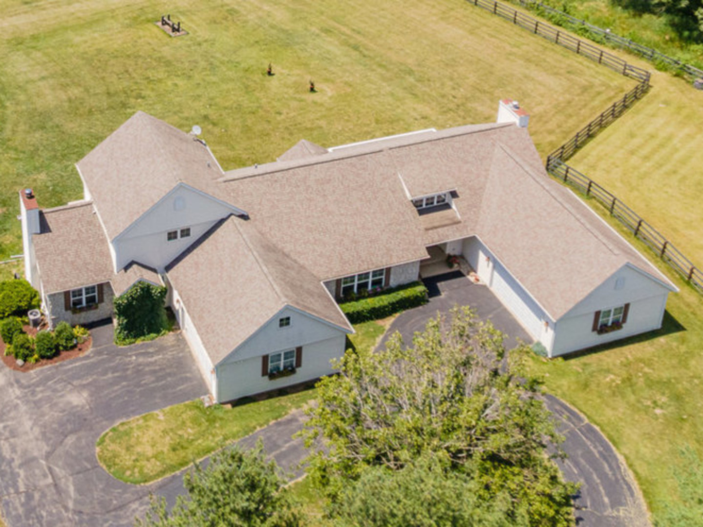 5284 Harvey Road Caledonia, IL 61011 - Photo 1 of 60 an aerial view of a house with a swimming pool