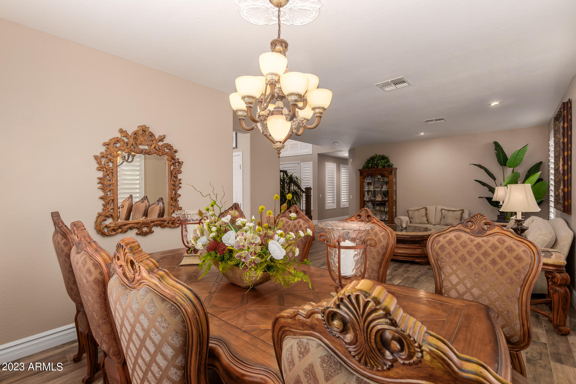 3416 West Montello Road Phoenix, AZ 85086 - Photo 11 of 71 a view of a dining room with furniture and a chandelier