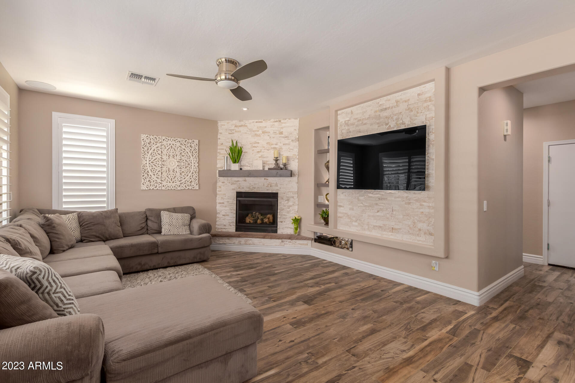 3416 West Montello Road Phoenix, AZ 85086 - Photo 14 of 71 a living room with furniture and a fireplace