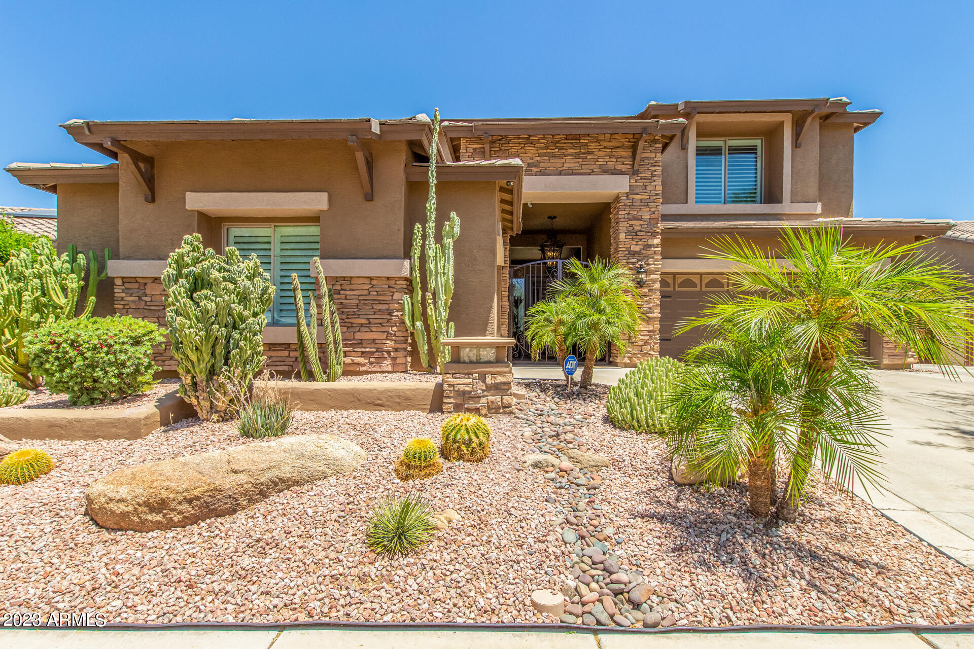 3416 West Montello Road Phoenix, AZ 85086 - Photo 2 of 71 a front view of a house with garden