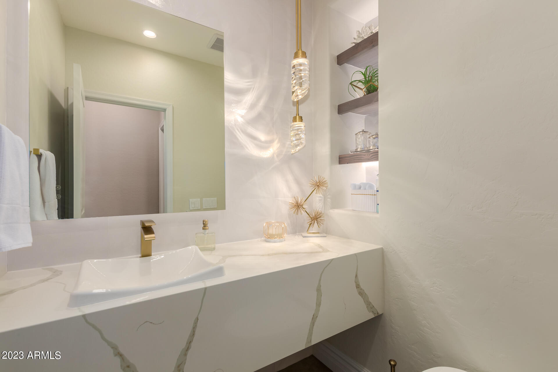 3416 West Montello Road Phoenix, AZ 85086 - Photo 25 of 71 a bathroom with a sink and a mirror