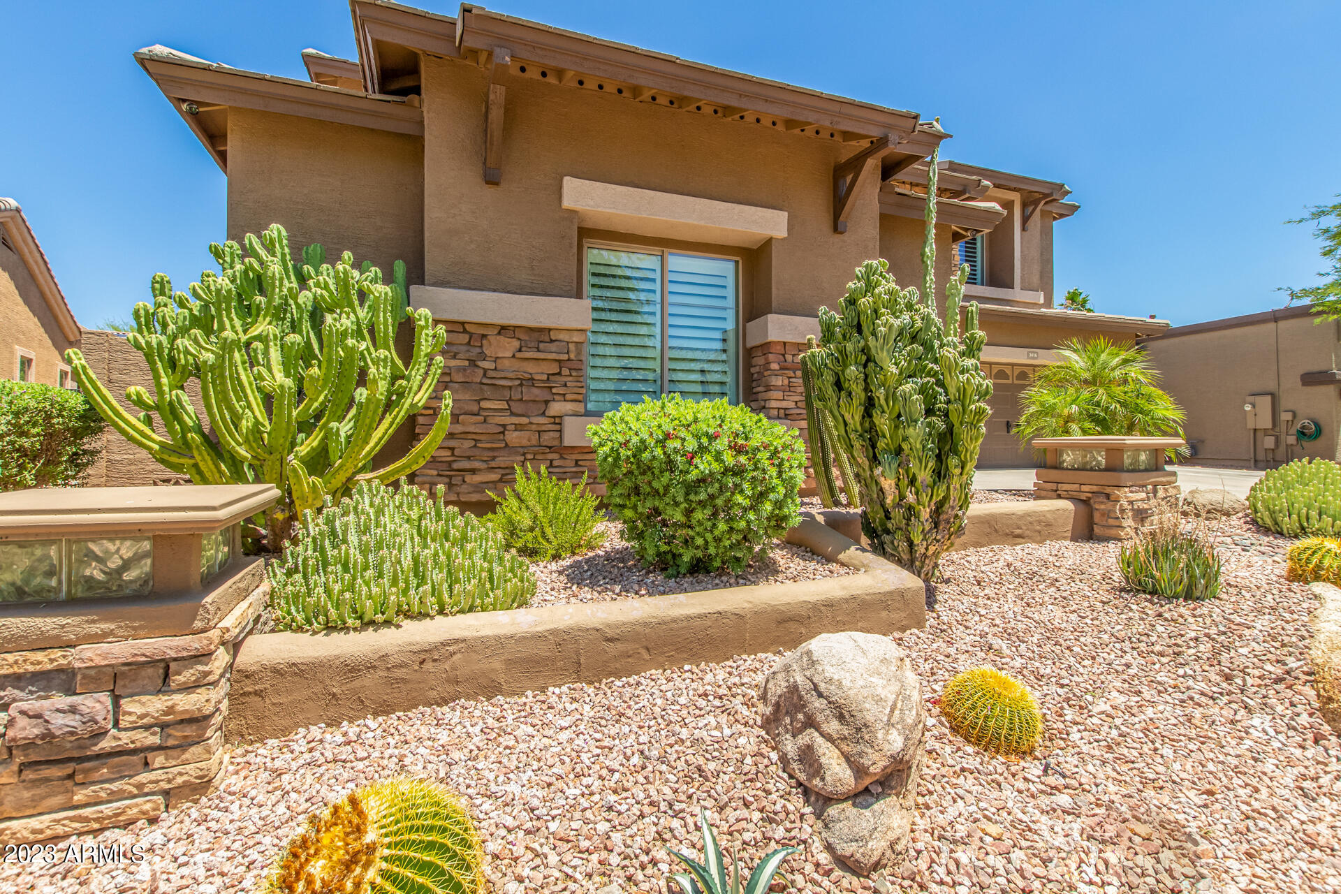 3416 West Montello Road Phoenix, AZ 85086 - Photo 3 of 71 a front view of a house with garden
