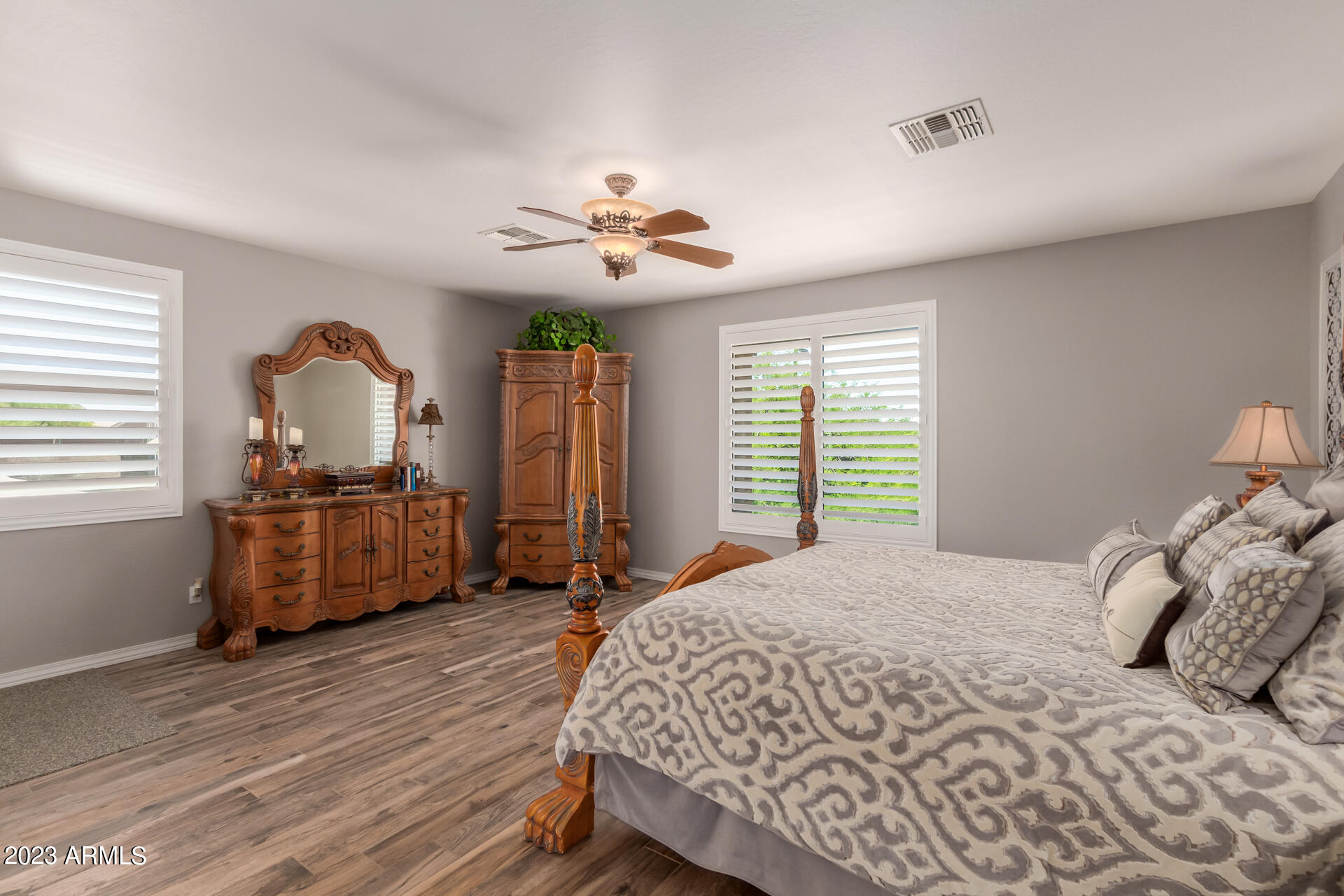 3416 West Montello Road Phoenix, AZ 85086 - Photo 31 of 71 a bedroom with a bed and a chandelier