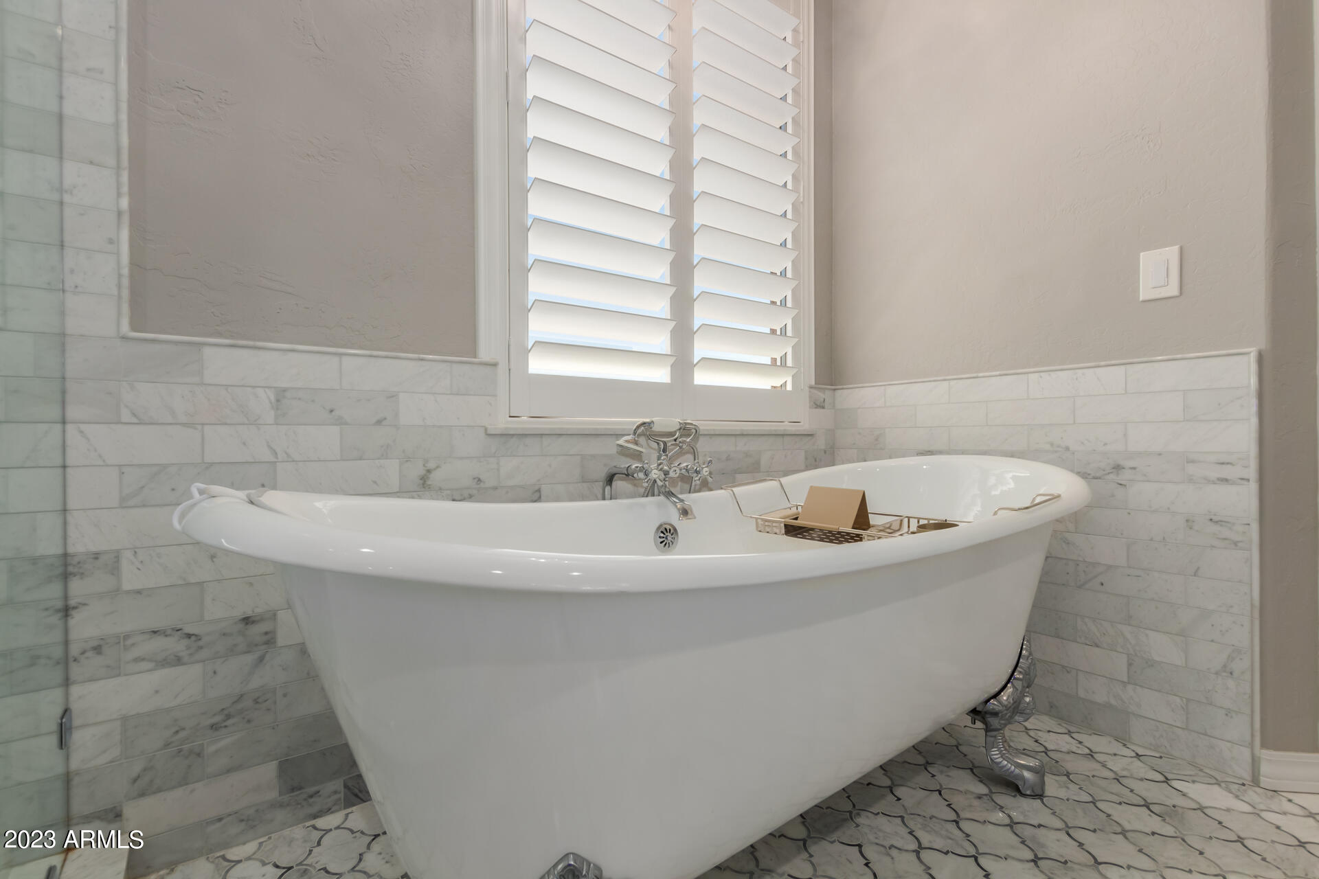 3416 West Montello Road Phoenix, AZ 85086 - Photo 37 of 71 a white bath tub sitting in a bathroom