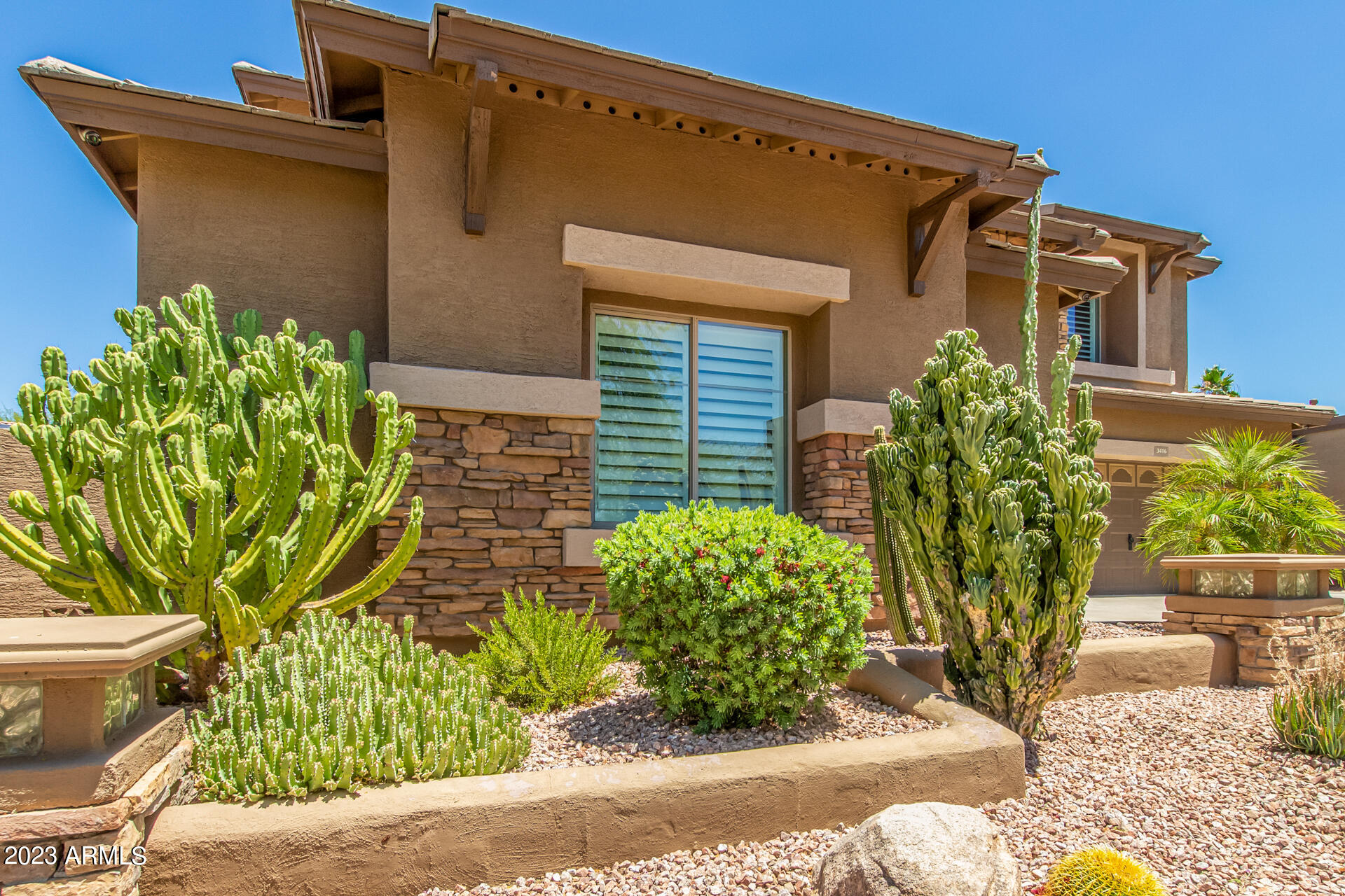 3416 West Montello Road Phoenix, AZ 85086 - Photo 4 of 71 a front view of a house with garden