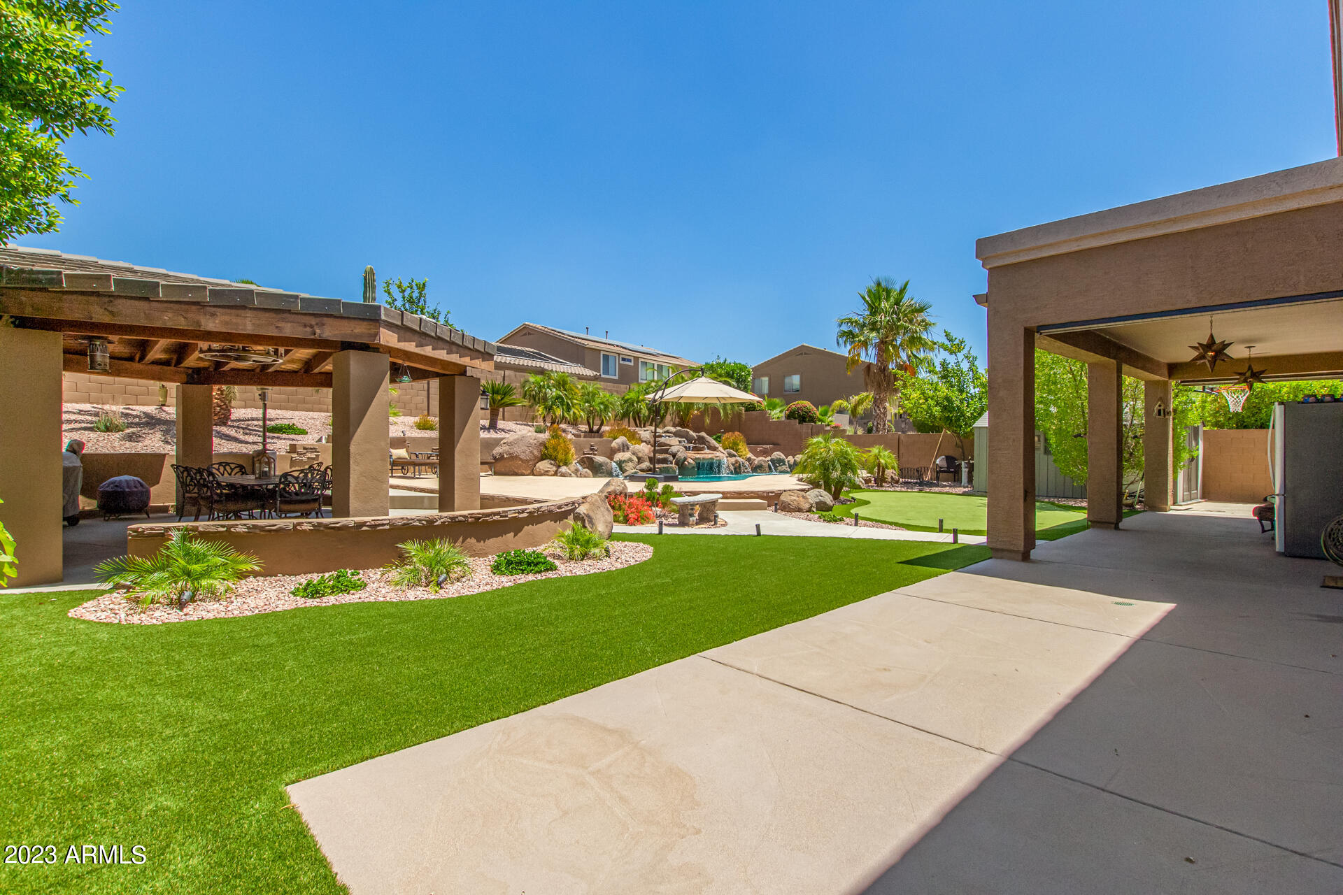 3416 West Montello Road Phoenix, AZ 85086 - Photo 48 of 71 a view of a house with backyard porch and garden