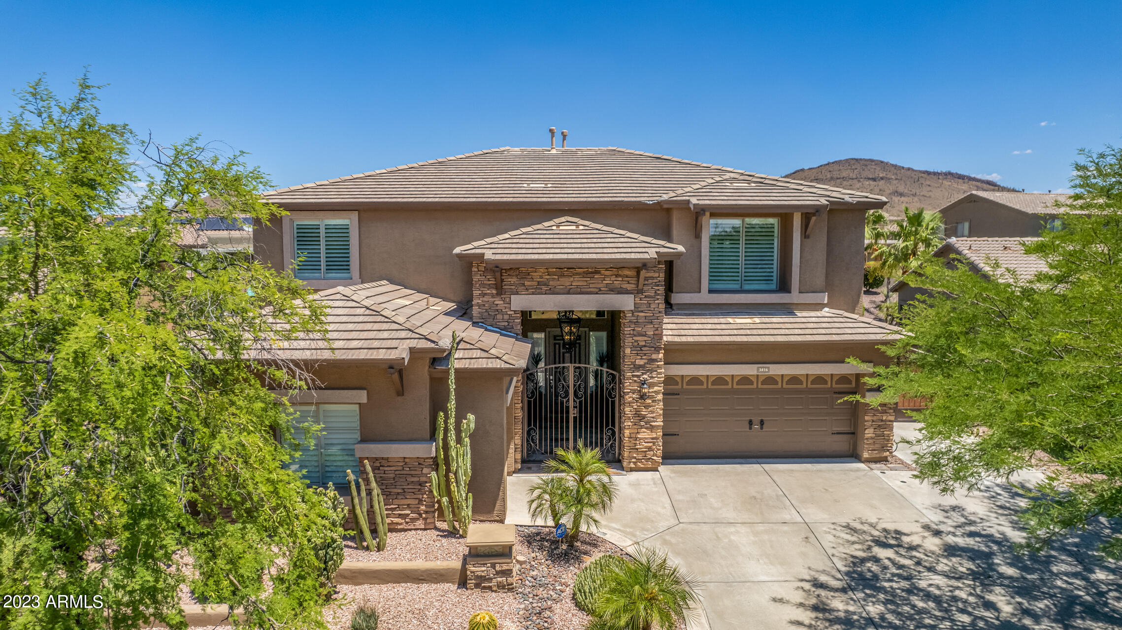 3416 West Montello Road Phoenix, AZ 85086 - Photo 57 of 71 a front view of a house with a yard