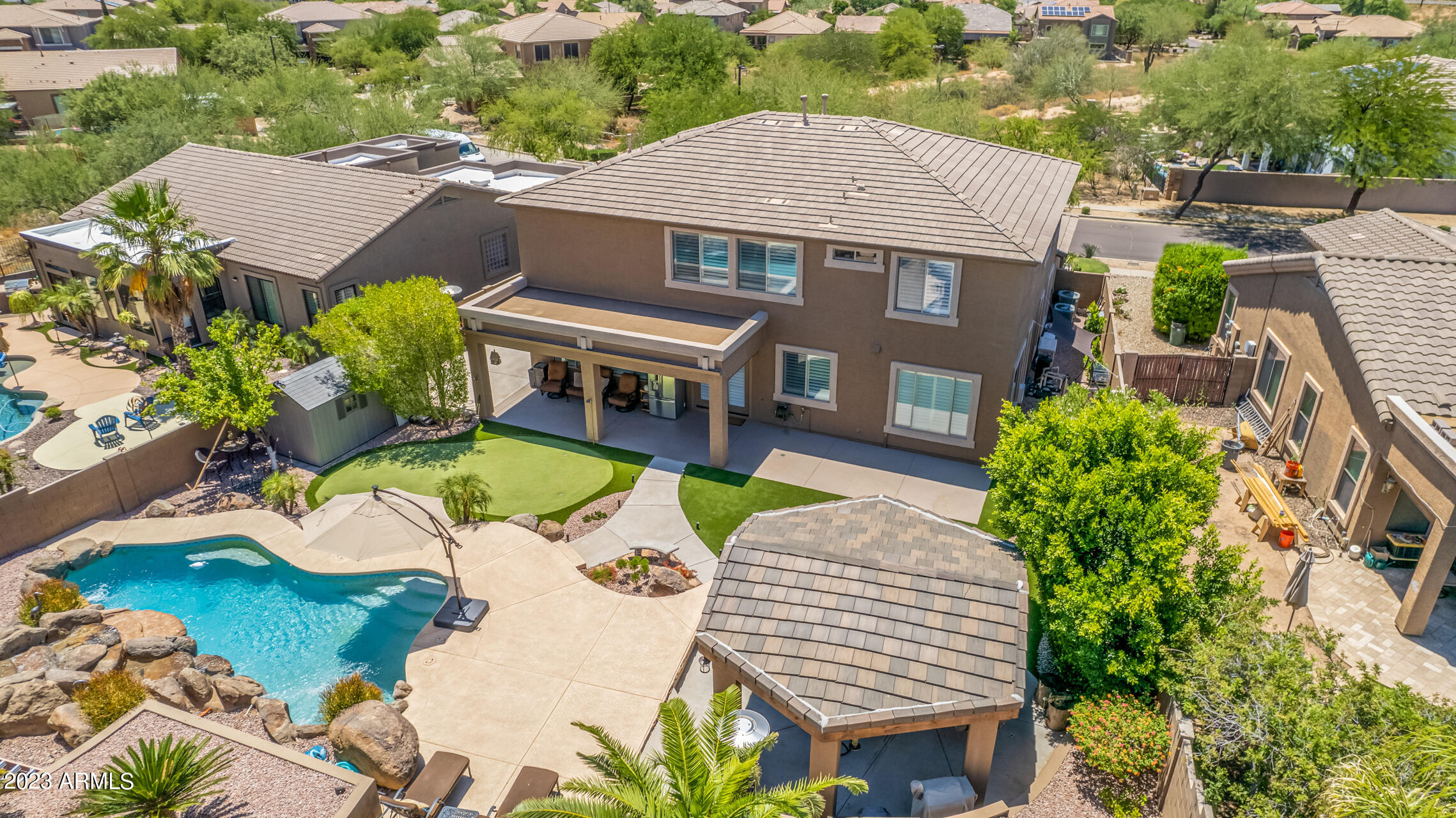 3416 West Montello Road Phoenix, AZ 85086 - Photo 62 of 71 an aerial view of a house with swimming pool and outdoor seating