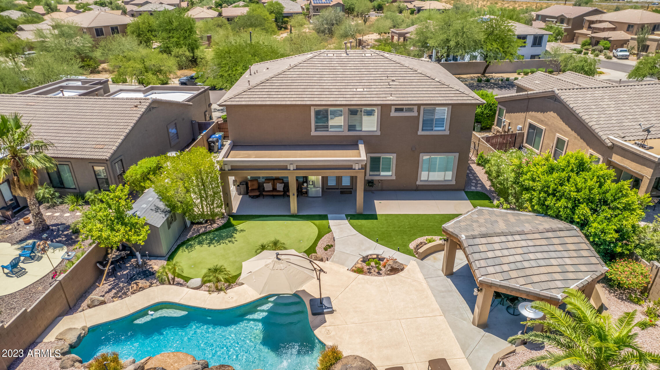 3416 West Montello Road Phoenix, AZ 85086 - Photo 63 of 71 an aerial view of a house with swimming pool garden and patio