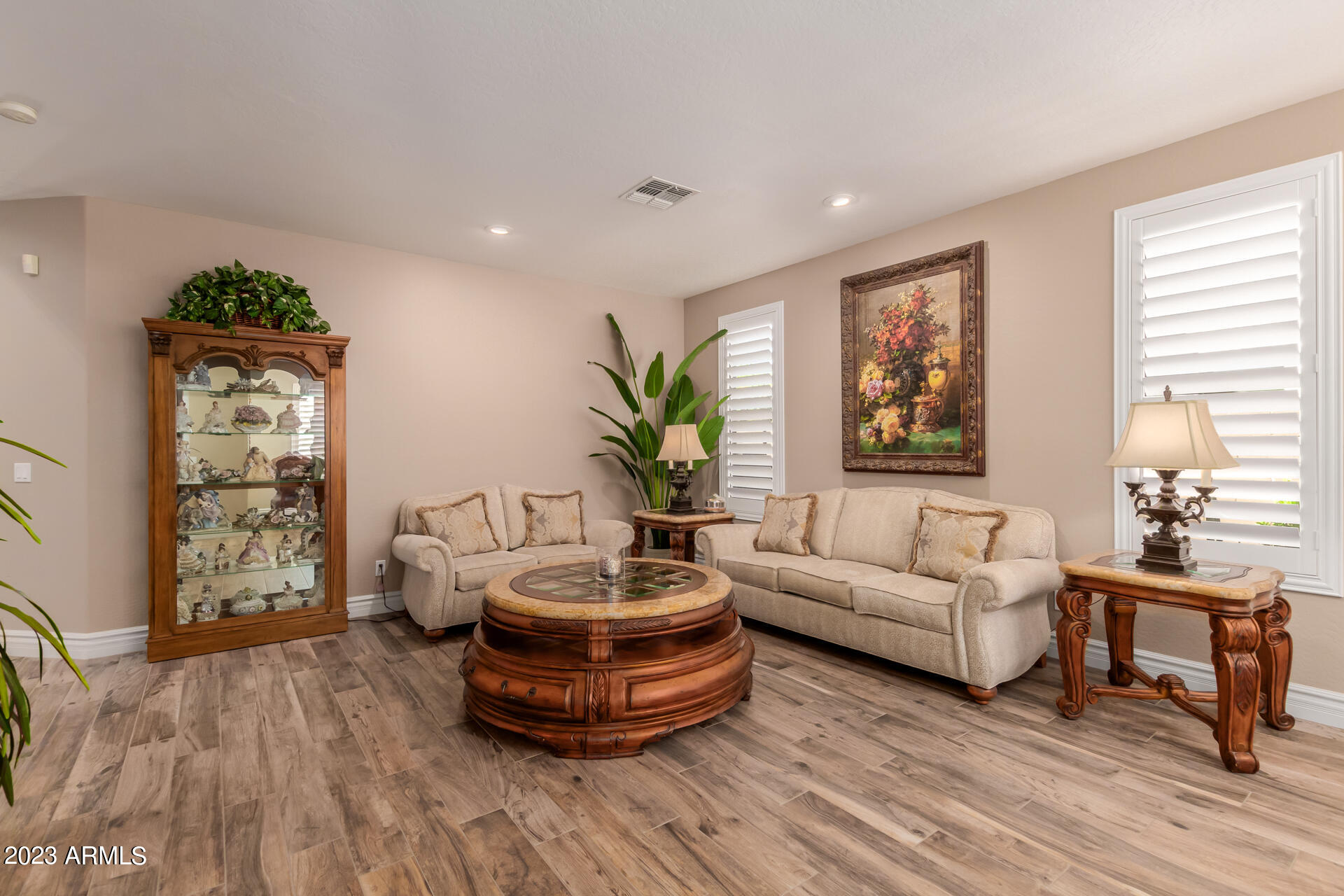 3416 West Montello Road Phoenix, AZ 85086 - Photo 8 of 71 a living room with furniture and a potted plant