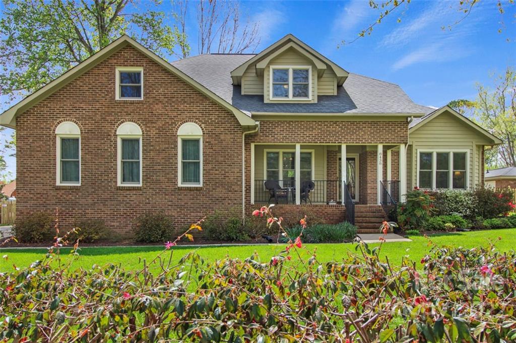 8438 Fairfield Forest Road Denver, NC 28037 - Photo 1 of 34 a front view of a house with garden
