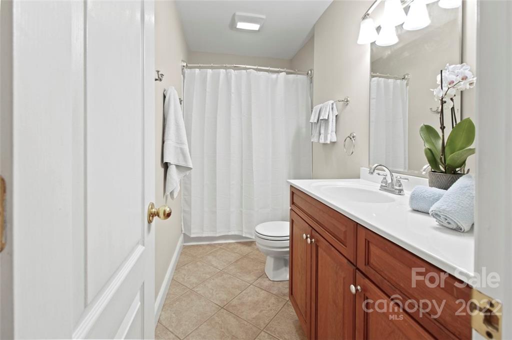 8438 Fairfield Forest Road Denver, NC 28037 - Photo 26 of 34 a bathroom with a double vanity sink toilet and shower