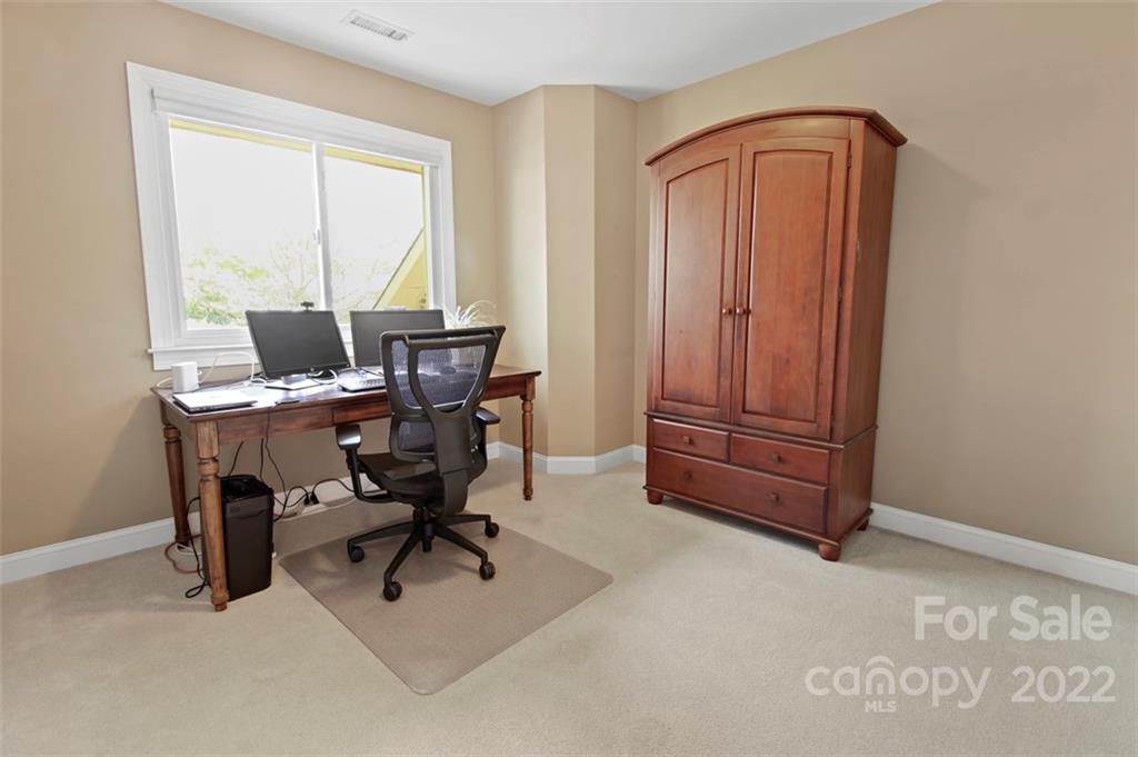 8438 Fairfield Forest Road Denver, NC 28037 - Photo 27 of 34 a workspace with furniture and a window