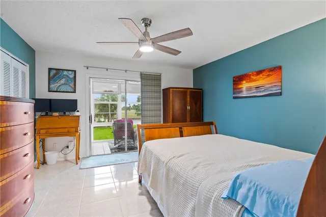 a bedroom with a bed and dresser