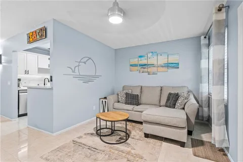 a living room with furniture and a table