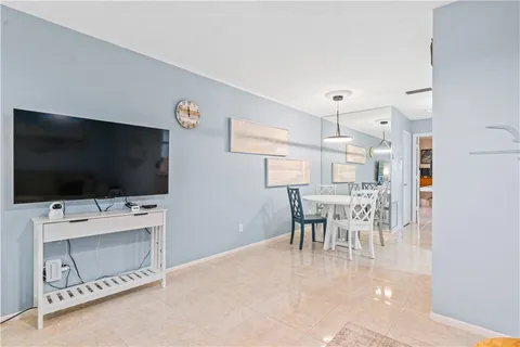 a view of a livingroom with furniture and a flat screen tv