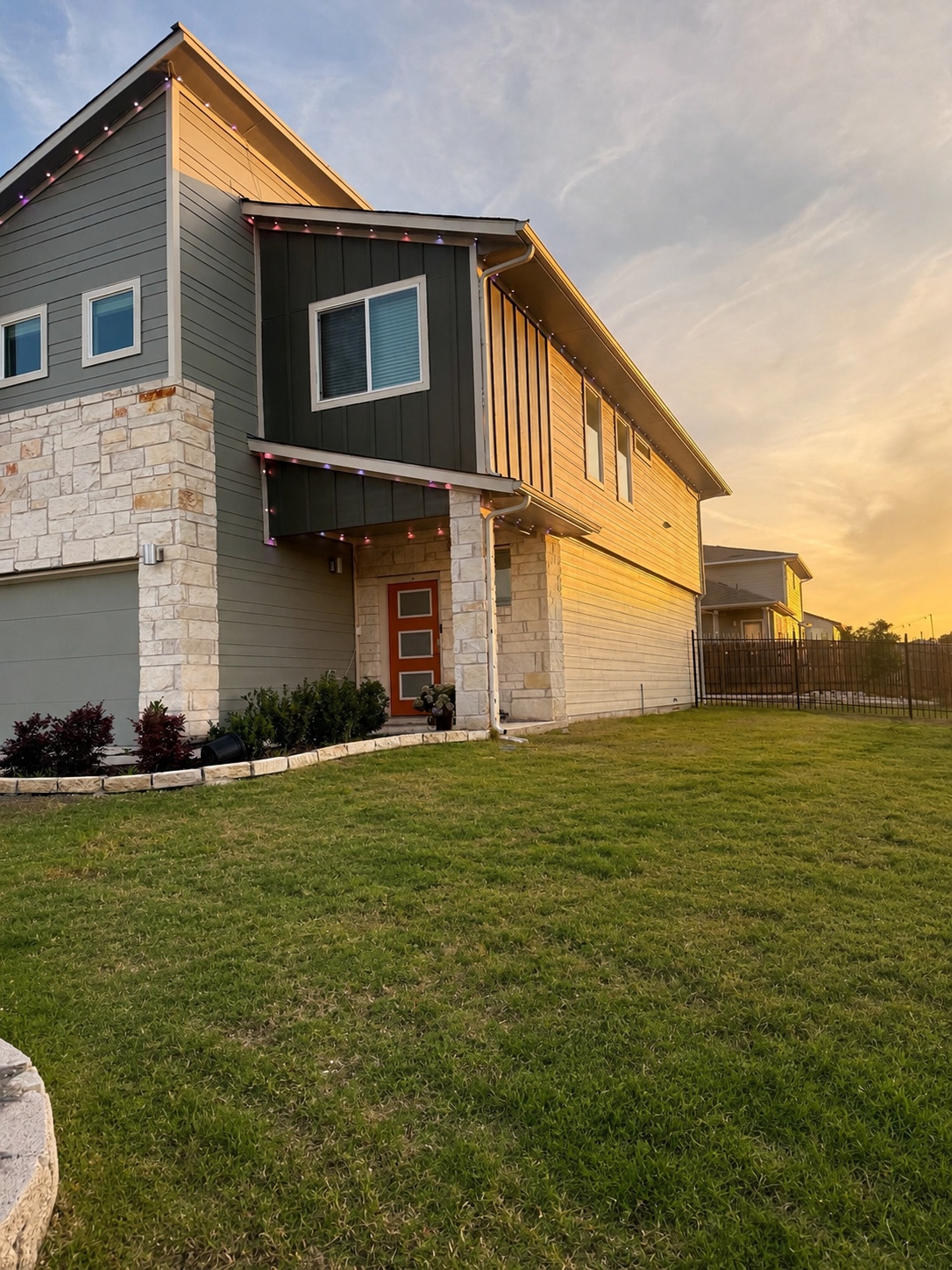 10924 Meris Lane Austin, TX 78754 - Photo 2 of 20 Contemporary facade featuring stone veneer and horizontal siding
