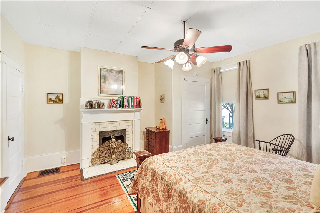 205 West Mauldin Street Walhalla, SC 29691 - Photo 18 of 43 Hardwood floors and a decorative fireplace create a restful sanctuary.
