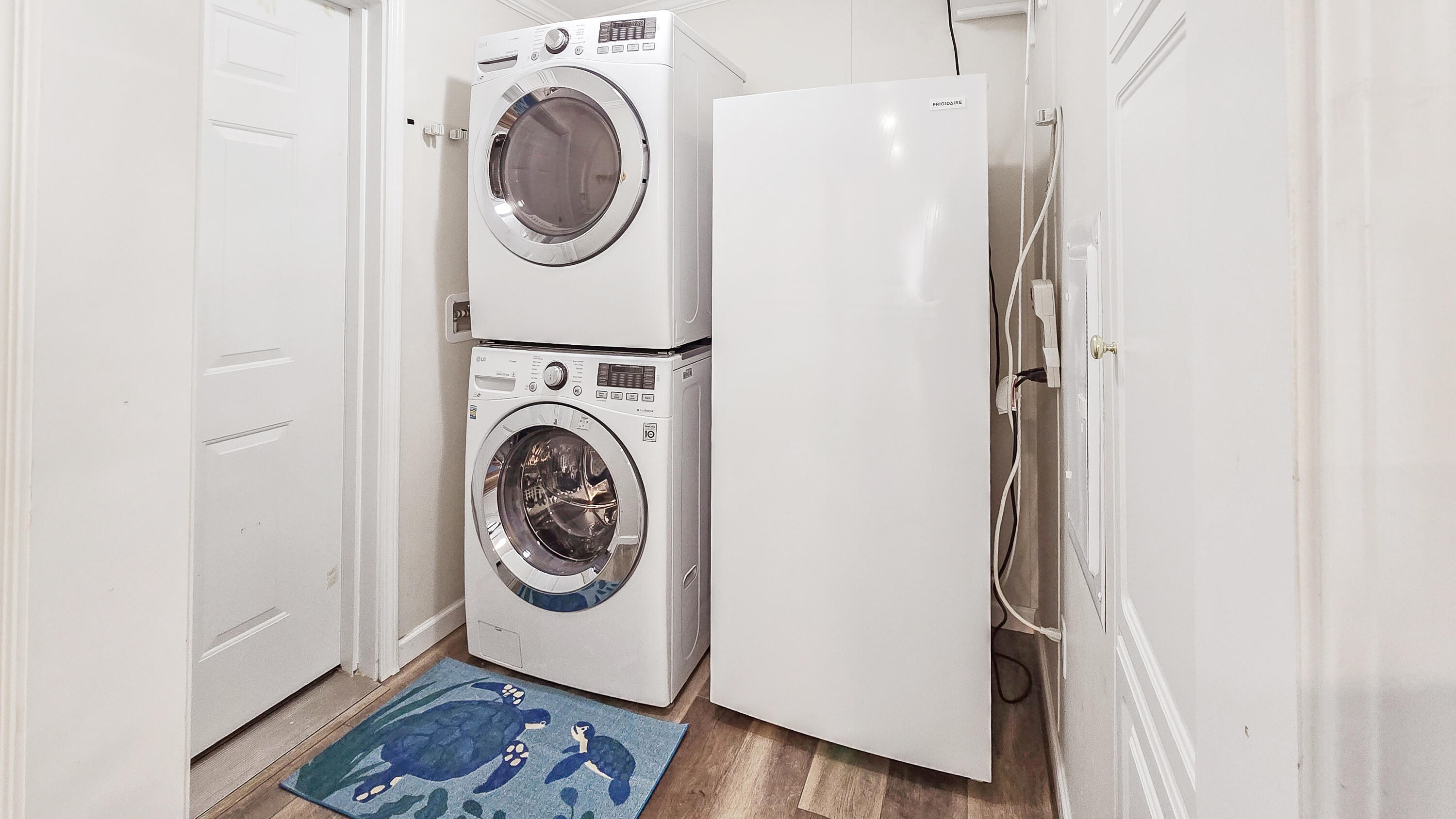 6939 Southeast Ridgeway Terrace Hobe Sound, FL 33455 - Photo 35 of 68 laundry room w/freezer