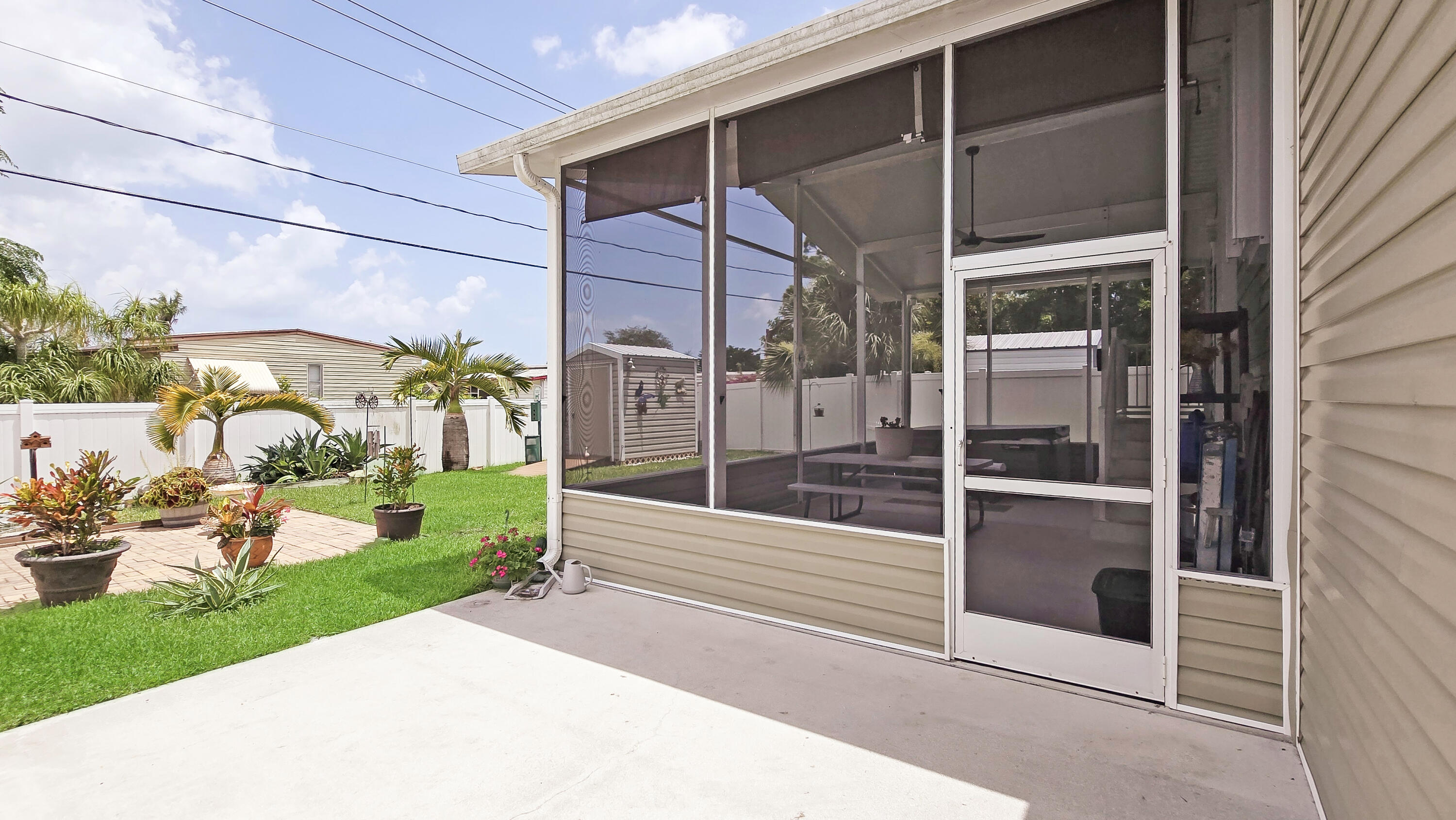6939 Southeast Ridgeway Terrace Hobe Sound, FL 33455 - Photo 45 of 68 outside concrete patio