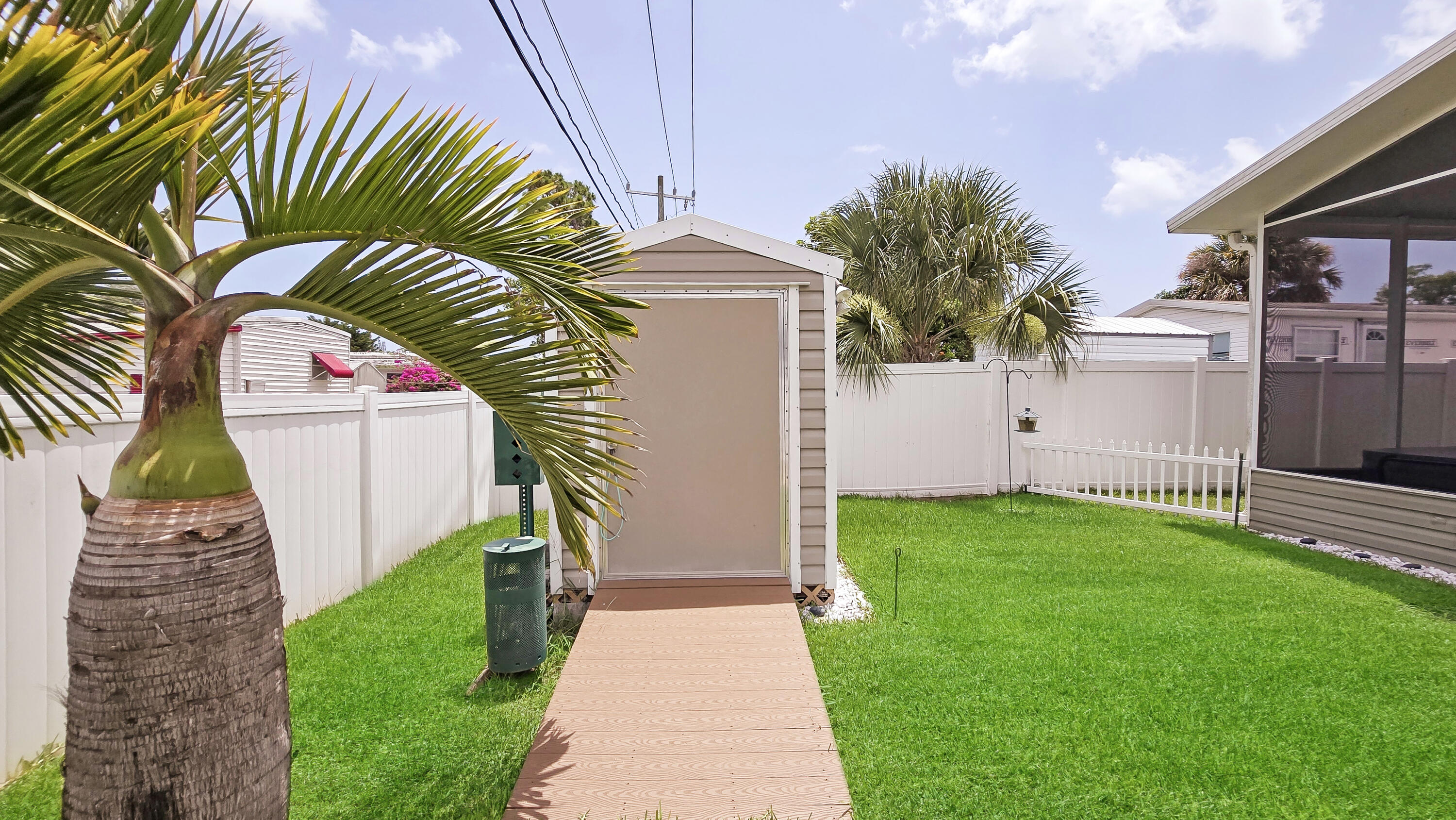 6939 Southeast Ridgeway Terrace Hobe Sound, FL 33455 - Photo 54 of 68 landscaped shed