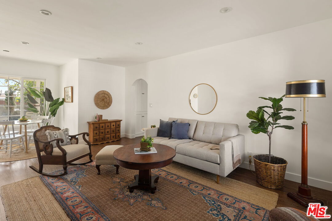 13610 Bracken Street Arleta, CA 91331 - Photo 1 of 23 a living room with furniture potted plant and a table