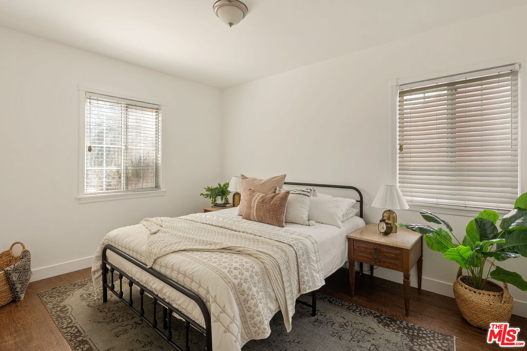 13610 Bracken Street Arleta, CA 91331 - Photo 15 of 23 a bedroom with a bed and a couch