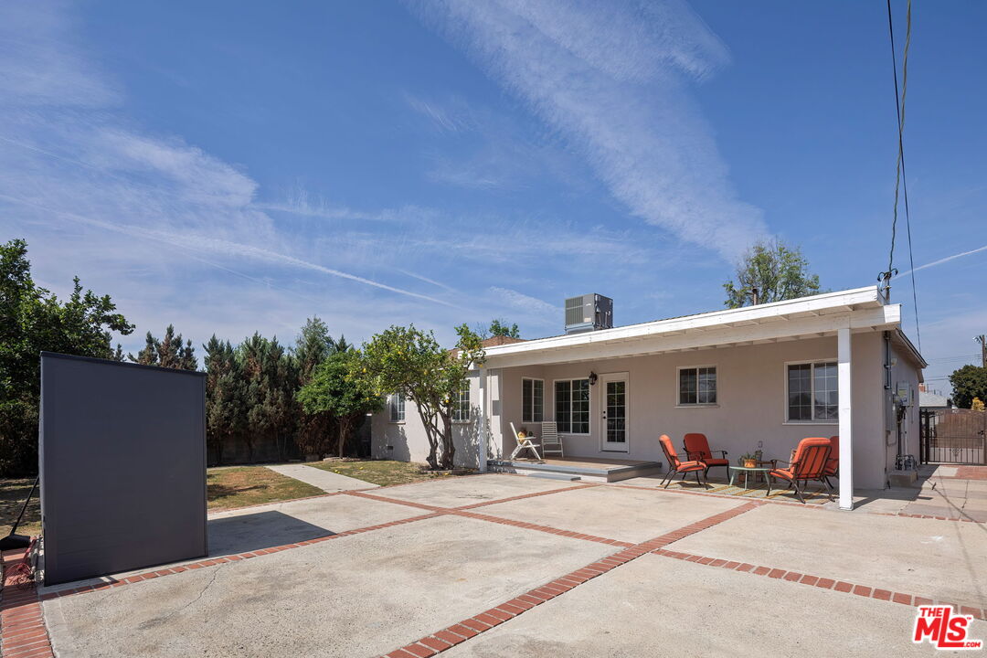 13610 Bracken Street Arleta, CA 91331 - Photo 22 of 23 a view of a white house with a patio