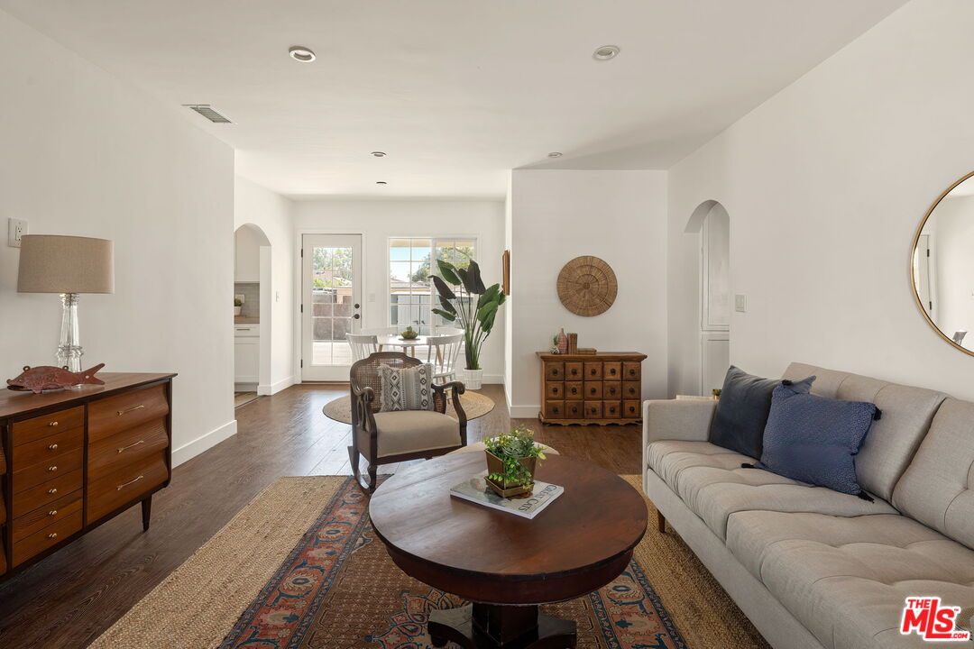 13610 Bracken Street Arleta, CA 91331 - Photo 5 of 23 a living room with furniture and a large window