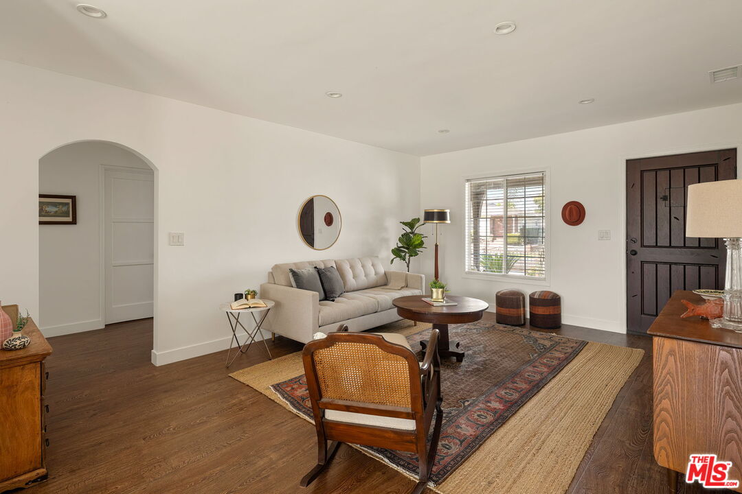 13610 Bracken Street Arleta, CA 91331 - Photo 6 of 23 a living room with furniture and a window