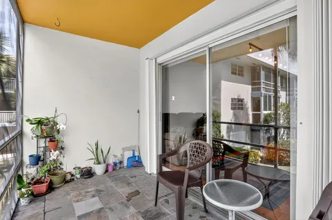 a backyard of a house with outdoor seating