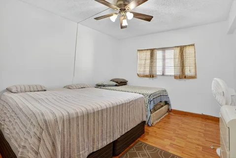 a bedroom with bed and window