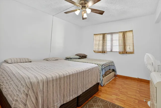 a bedroom with bed and window