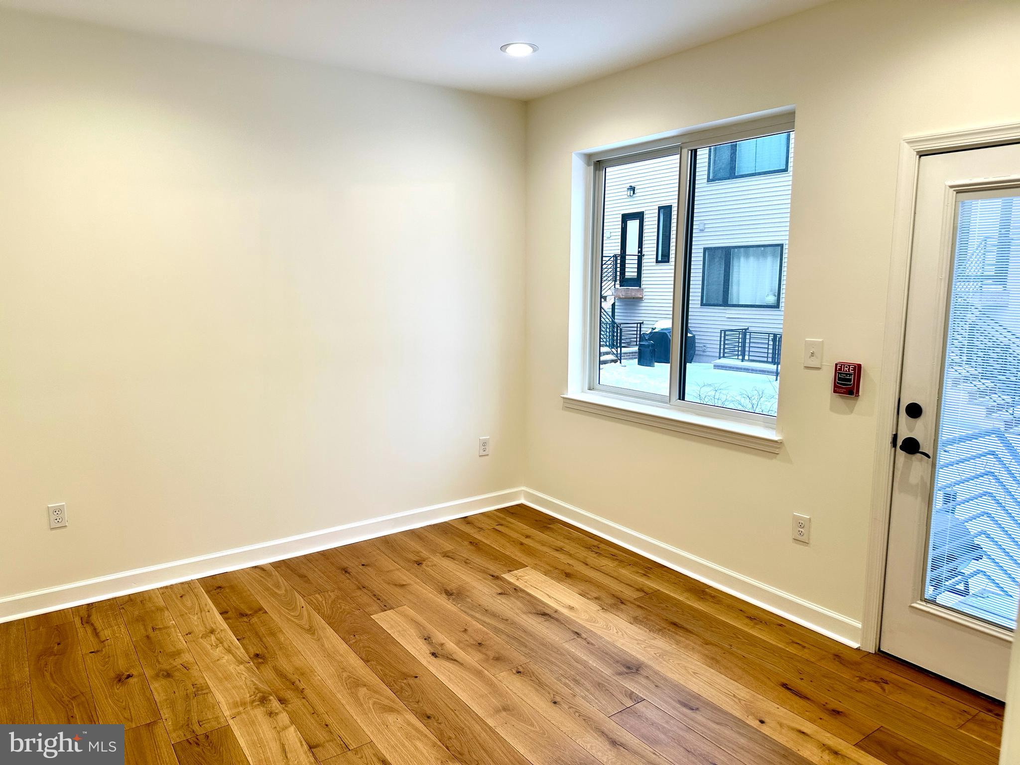 2009 North Reese Street, Unit 8B Philadelphia, PA 19122 - Photo 9 of 12 a view of a room with wooden floor and cabinet