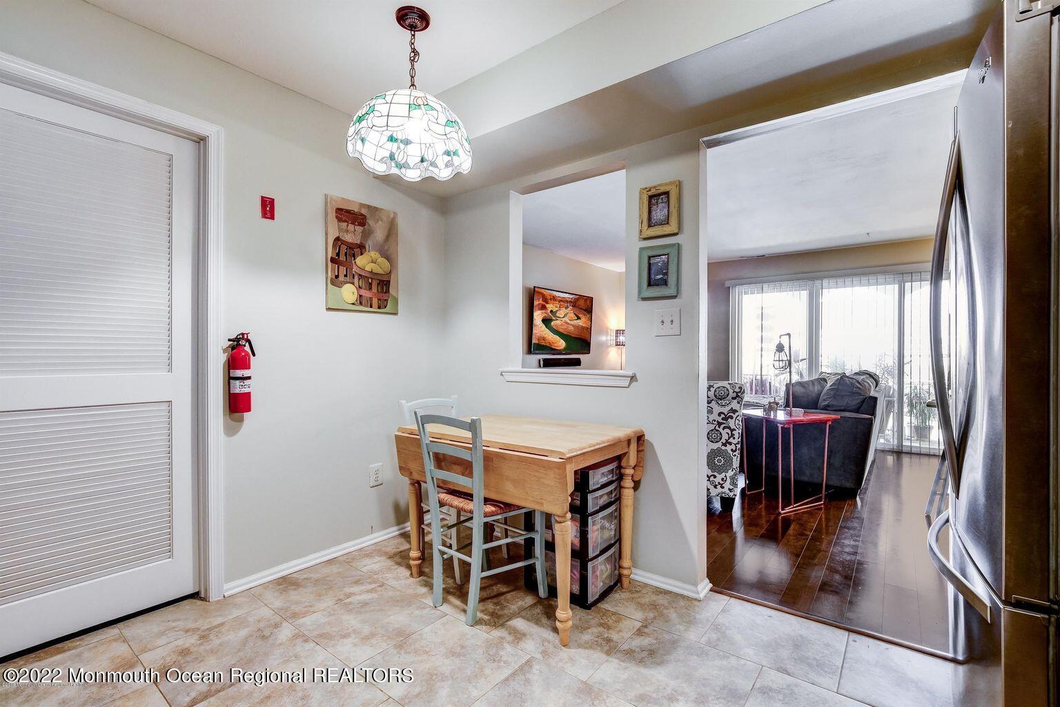 123 Hyacinth Lane Freehold, NJ 07728 - Photo 11 of 28 a dining room with furniture and chandelier